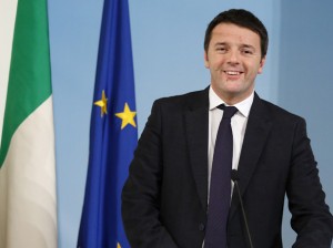 Italy's Prime Minister Renzi smiles as he arrives to lead a news conference at Chigi palace in Rome